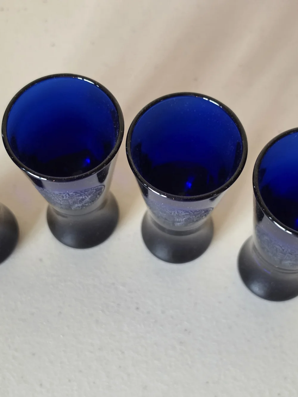 Set of 4 Cobalt Blue Floral Crest Etched Glass Shot Glasses